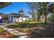 Large backyard with mature trees and lush greenery at 604 W 10Th St, Lakeland, FL 33805