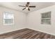 Bedroom featuring new floors and two large windows at 604 W 10Th St, Lakeland, FL 33805