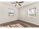 Bedroom featuring new floors and two large windows at 604 W 10Th St, Lakeland, FL 33805