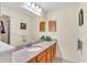 Bathroom featuring a single sink vanity with granite counter and large mirror at 6211 Crane Dr, Lakeland, FL 33809