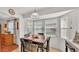 Dining area with tile floors, wooden table, and a large window at 6211 Crane Dr, Lakeland, FL 33809