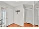 View of the foyer with wood flooring, white front door and closet at 6211 Crane Dr, Lakeland, FL 33809