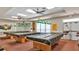 Game room with pool tables, overhead lighting, and comfortable seating at 6211 Crane Dr, Lakeland, FL 33809