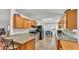 Bright kitchen featuring granite countertops, wood cabinetry, and black appliances at 6211 Crane Dr, Lakeland, FL 33809