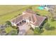 Beautiful home aerial view featuring lush landscaping and a brick driveway at 6383 Summertimes Plantation Blvd, Bartow, FL 33830