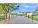 Relaxing backyard deck offers views of the fenced yard and surrounding landscape at 6383 Summertimes Plantation Blvd, Bartow, FL 33830