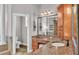 Bathroom vanity with granite counters, wood cabinets, and tiled flooring at 6383 Summertimes Plantation Blvd, Bartow, FL 33830