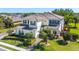 Aerial view of a two-story home with well-maintained landscaping and neutral color scheme at 6515 Eagle View Loop, Lakeland, FL 33813