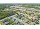 Aerial view shows a residential area with lakes and mature tree landscaping throughout the community at 6515 Eagle View Loop, Lakeland, FL 33813