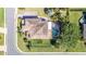 Bird's eye view shows the pool, tile roof, and landscaping of the house at 6515 Eagle View Loop, Lakeland, FL 33813