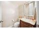 Powder room featuring an ornate vanity, unique mosaic tile accent wall, and modern fixtures at 6515 Eagle View Loop, Lakeland, FL 33813