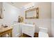 Bathroom featuring a walk-in tub, tiled walls, and a vanity with a marble countertop at 6515 Eagle View Loop, Lakeland, FL 33813