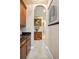 Hallway featuring a decorative console table with an ornate vase, and a framed fruit still-life at 6515 Eagle View Loop, Lakeland, FL 33813