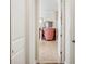 Hallway view to a vanity and a glimpse of the luxurious bathroom at 6515 Eagle View Loop, Lakeland, FL 33813