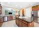 Well-equipped kitchen featuring granite countertops, stainless steel appliances, and central island with bar seating at 6515 Eagle View Loop, Lakeland, FL 33813