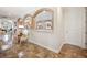 Formal dining room with tile floor. Arched openings looking into living area. Interior shot at 6515 Eagle View Loop, Lakeland, FL 33813