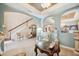 Elegant living room featuring a staircase, sophisticated decor, and a refined ambiance, perfect for relaxation at 6515 Eagle View Loop, Lakeland, FL 33813