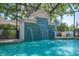 Pool featuring a waterfall feature cascading into a clear turquoise pool and spa at 6515 Eagle View Loop, Lakeland, FL 33813