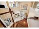 Spacious foyer with wood staircase and floors, leading to the front door at 6515 Eagle View Loop, Lakeland, FL 33813