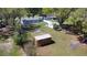 Aerial view of backyard featuring sheds and surrounding trees at 6525 Glen Meadow Dr, Lakeland, FL 33810