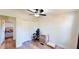 Additional bedroom with a ceiling fan, closet, and hardwood-style floors at 6525 Glen Meadow Dr, Lakeland, FL 33810