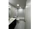Modern bathroom featuring a shower-tub combo with a white marble tile surround and sleek fixtures at 692 Augusta Rd, Winter Haven, FL 33884