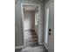 Open doorway view of bedroom with new gray flooring and natural light at 692 Augusta Rd, Winter Haven, FL 33884