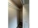 A bright walk-in closet with built-in wire shelving for ample storage and organization at 692 Augusta Rd, Winter Haven, FL 33884