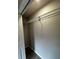 A bright walk-in closet with built-in wire shelving for ample storage and organization at 692 Augusta Rd, Winter Haven, FL 33884