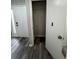 Entryway view of coat closet and modern wood-look flooring at 692 Augusta Rd, Winter Haven, FL 33884