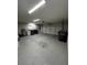 Large garage with laundry area and space for storage and vehicles at 692 Augusta Rd, Winter Haven, FL 33884