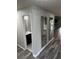 Mirrored hallway with the bathroom on the left and living area straight ahead at 692 Augusta Rd, Winter Haven, FL 33884