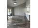 Open floor plan living room area with sliding glass doors that lead to the outdoor lanai at 692 Augusta Rd, Winter Haven, FL 33884