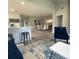 Open-concept living area showcasing wood floors, a modern kitchen, and comfortable seating at 692 Augusta Rd, Winter Haven, FL 33884