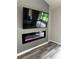 Living room featuring an electric fireplace below the mounted tv at 692 Augusta Rd, Winter Haven, FL 33884