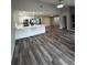 Open-concept living space features new flooring and updated kitchen at 692 Augusta Rd, Winter Haven, FL 33884