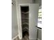 Well-organized pantry with ample shelving for storage at 692 Augusta Rd, Winter Haven, FL 33884