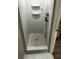 Modern tiled shower with mosaic tile floor and overhead shower head at 692 Augusta Rd, Winter Haven, FL 33884