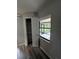 Bright hallway storage closet and window overlooking a screened in patio at 692 Augusta Rd, Winter Haven, FL 33884