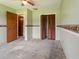 Bedroom featuring open doors to other rooms and a closet adding to the home's accessibility and storage at 6940 Newman E Cir, Lakeland, FL 33811