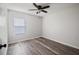 Bright bedroom with wood floors and plenty of natural light at 726 Chacall Loop, Mount Dora, FL 32757