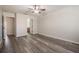 Bright bedroom featuring wood-look flooring and a ceiling fan at 726 Chacall Loop, Mount Dora, FL 32757