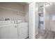 A dedicated laundry room with shelving for convenience at 726 Chacall Loop, Mount Dora, FL 32757