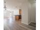 Bright living room and kitchen area with durable wood flooring and modern fixtures at 726 Chacall Loop, Mount Dora, FL 32757