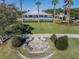 Aerial view of the community pool and clubhouse surrounded by lush landscaping and ample seating at 726 Chacall Loop, Mount Dora, FL 32757