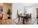 Bright dining room with a chandelier, large mirror, and ample natural light at 7289 Liberty Rd, Lakeland, FL 33809