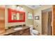 Bathroom featuring a single sink vanity with stone countertop and a walk-in shower at 8621 Plantation Ridge Blvd, Lakeland, FL 33809