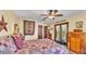 Cozy bedroom with charming decor and a comfortable quilt-covered bed at 8621 Plantation Ridge Blvd, Lakeland, FL 33809