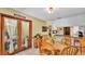 Charming dining area with wood furnishings and access to both the kitchen and living room at 8621 Plantation Ridge Blvd, Lakeland, FL 33809