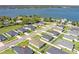A waterfront community features well-maintained homes, lush greenery, and convenient street access with gorgeous lake views at 925 First Dr, Eagle Lake, FL 33839